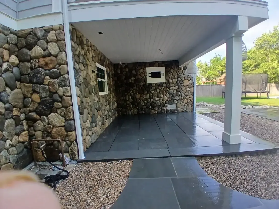 Finished natural stone wall installation in Connecticut